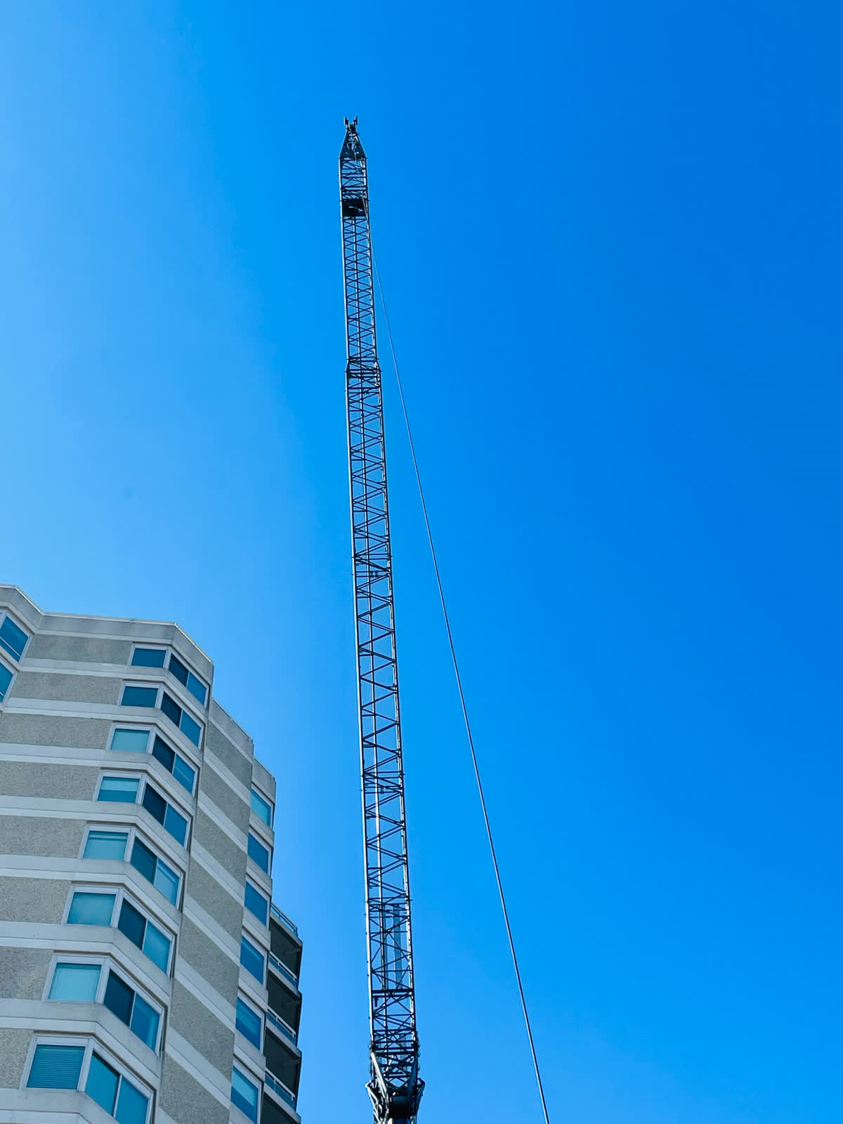 Crane lifting equipment to a roof