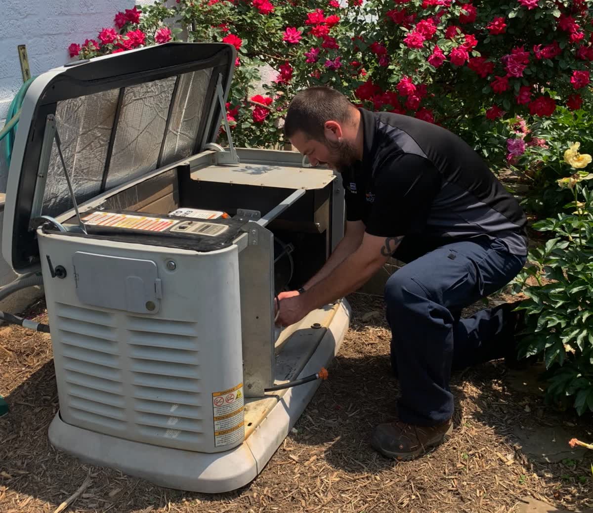 Technician servicing a standby generator